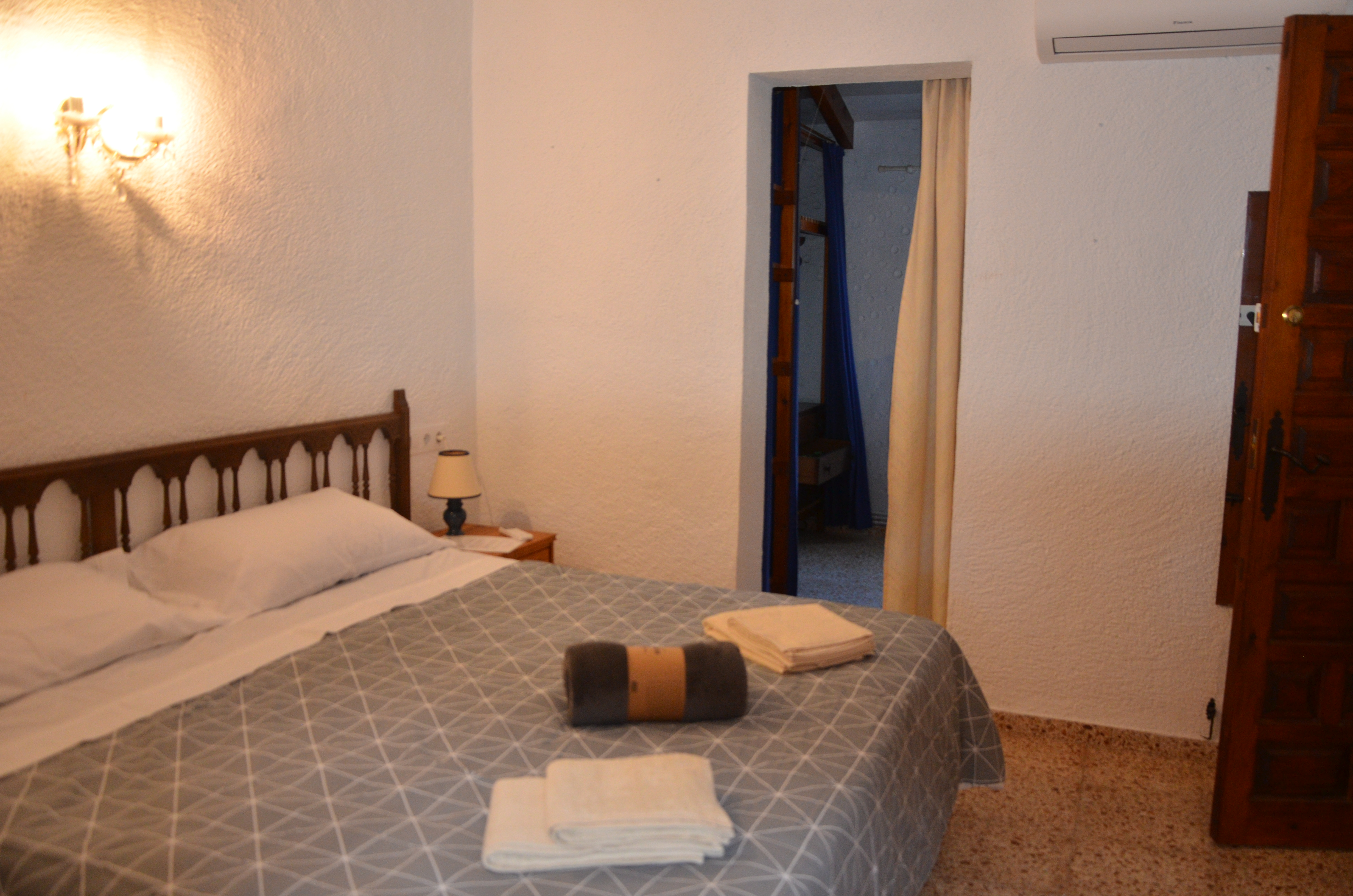 Bedroom with double bed and fresh towels