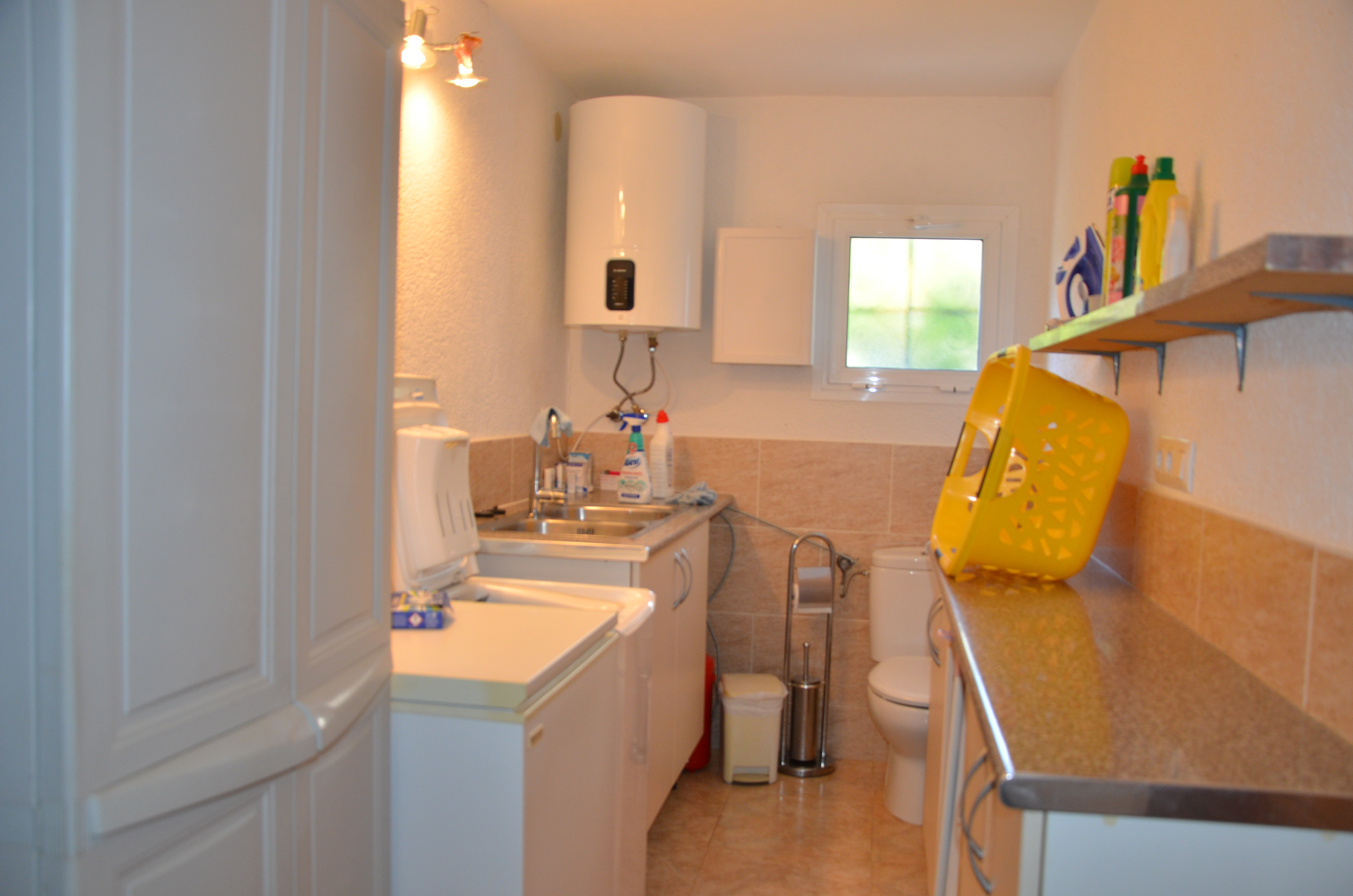Utility room with sink and storage